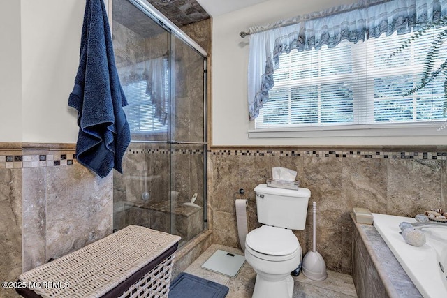 32 Tilton Rd, Brick, NJ 08723 - full bathroom featuring tile walls, a stall shower, tiled tub, a wainscoted wall, and tile patterned flooring