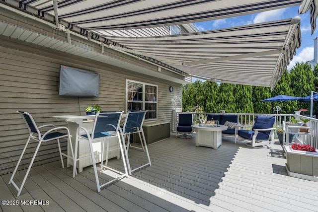 32 Tilton Rd, Brick, NJ 08723 - wooden deck with outdoor dining area and a fire pit
