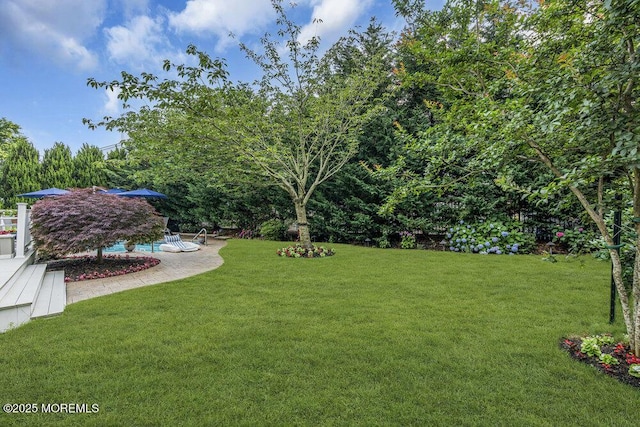 32 Tilton Rd, Brick, NJ 08723 - view of green lawn with a pool and a patio area