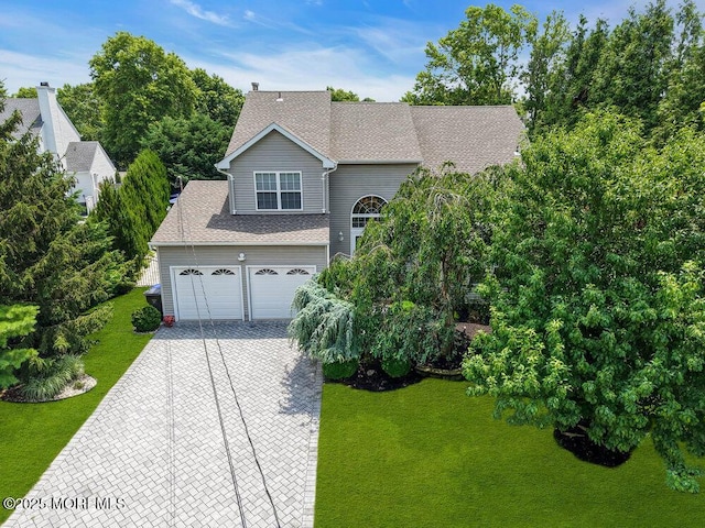 32 Tilton Rd, Brick, NJ 08723 - view of front of property with decorative driveway, a front yard, and a shingled roof