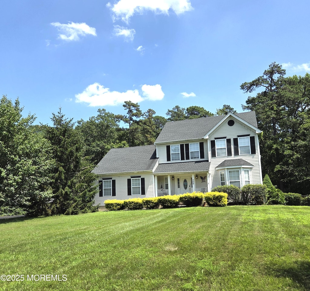 309 Nighthawk Ln, Jackson, NJ 08527 - view of front facade with a porch, a front lawn, and a shingled roof