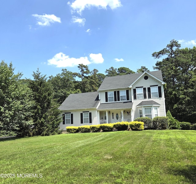309 Nighthawk Ln, Jackson, NJ 08527 - view of front facade with a porch, a front lawn, and a shingled roof