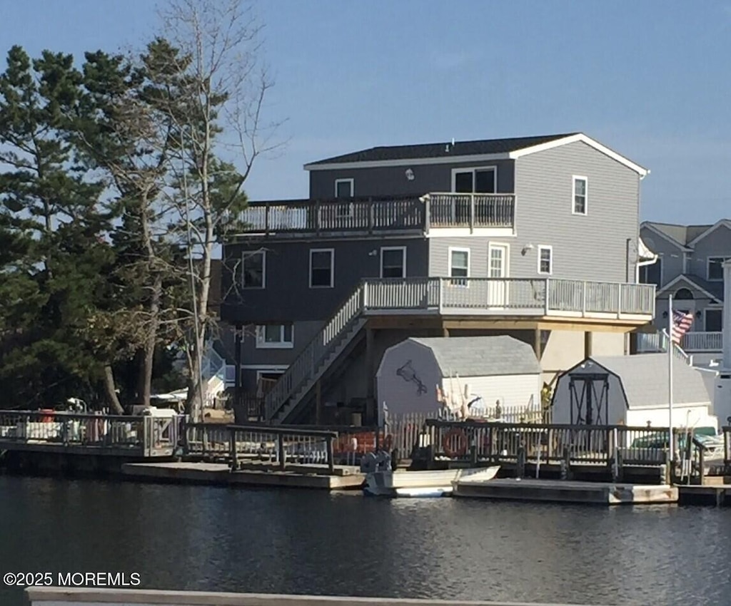 27 Robert Dr, Beach Haven West, NJ 08050 - dock area featuring a water view and a balcony