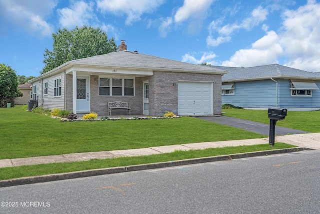 171 Biabou Dr, Toms River, NJ 08757 - view of front facade featuring a garage, asphalt driveway, a chimney, brick siding, and a front lawn