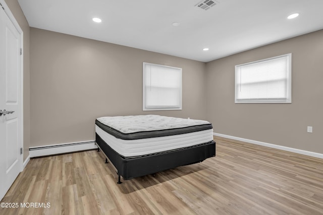 171 Biabou Dr, Toms River, NJ 08757 - bedroom featuring a baseboard heating unit, light wood-style floors, and recessed lighting