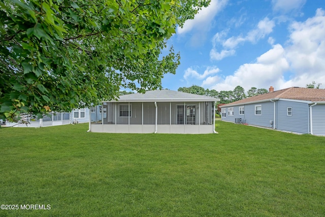 171 Biabou Dr, Toms River, NJ 08757 - back of house featuring a sunroom and a lawn