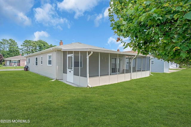 171 Biabou Dr, Toms River, NJ 08757 - back of property with a sunroom, a lawn, and a chimney
