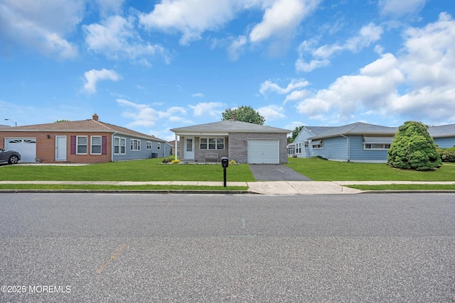 171 Biabou Dr, Toms River, NJ 08757 - view of front facade featuring an attached garage, a front lawn, concrete driveway, and brick siding