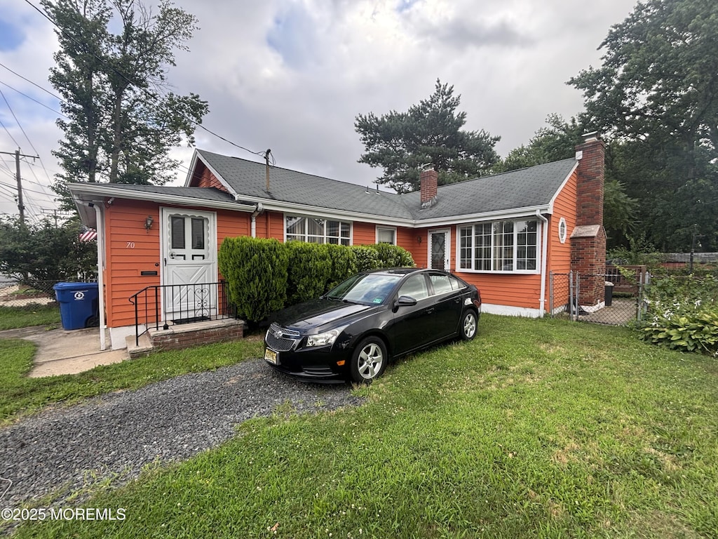70 Bray Ave, North Middletown, NJ 07748 - single story home with a chimney and a front yard