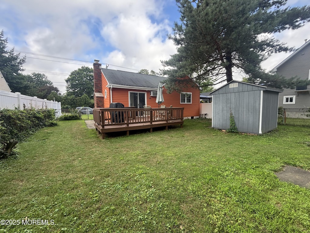 70 Bray Ave, North Middletown, NJ 07748 - back of property with a deck, a shed, a chimney, and roof with shingles