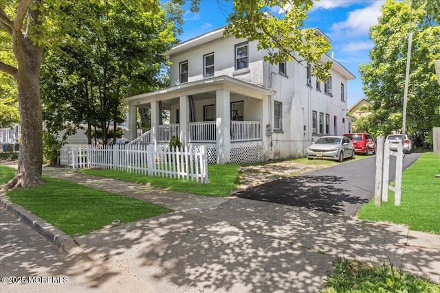 1015 Mattison Ave, Asbury Park, NJ 07712 - traditional style home featuring a porch, stucco siding, and driveway