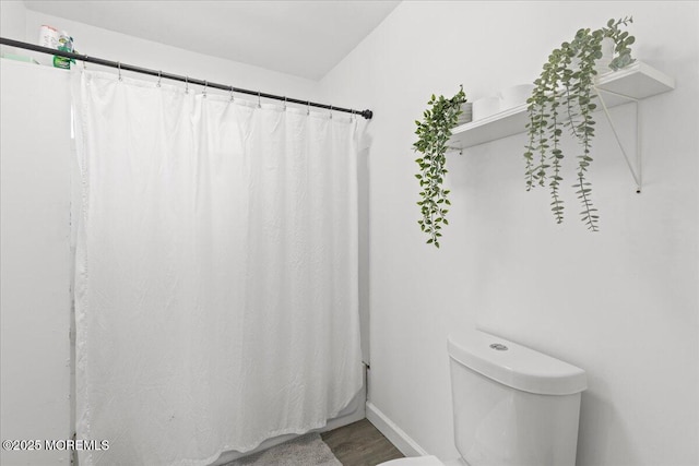 1015 Mattison Ave, Asbury Park, NJ 07712 - full bathroom with wood finished floors and a shower with shower curtain
