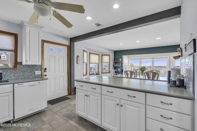 2400 Ocean Front, Lavallette, NJ 08735 - kitchen with dishwasher, backsplash, white cabinetry, recessed lighting, and plenty of natural light