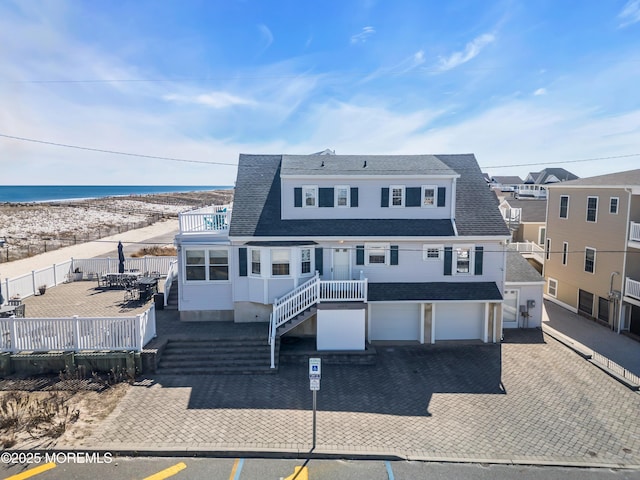 2400 Ocean Front, Lavallette, NJ 08735 - back of property featuring a garage, a shingled roof, and a wooden deck