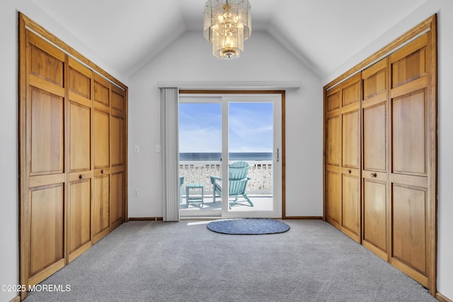 2400 Ocean Front, Lavallette, NJ 08735 - carpeted bedroom with access to exterior, lofted ceiling, and a chandelier