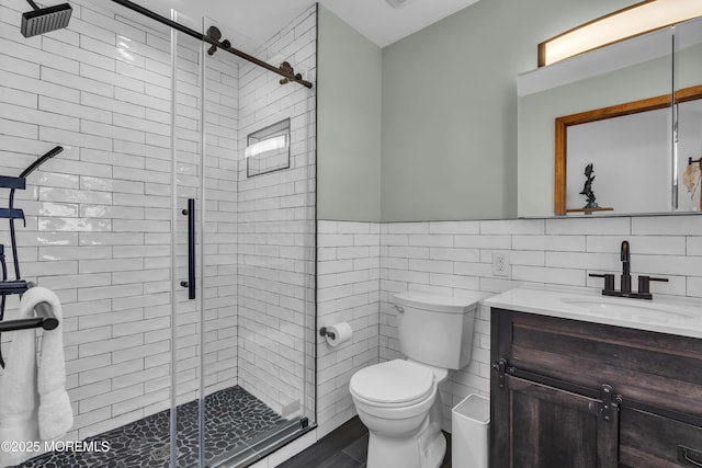 2400 Ocean Front, Lavallette, NJ 08735 - bathroom featuring tile walls, vanity, a shower stall, and a wainscoted wall