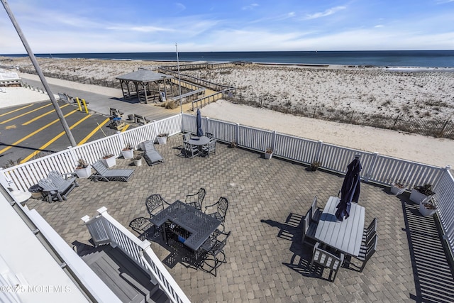 2400 Ocean Front, Lavallette, NJ 08735 - fenced backyard featuring outdoor dining area, view of water and beach, and a patio