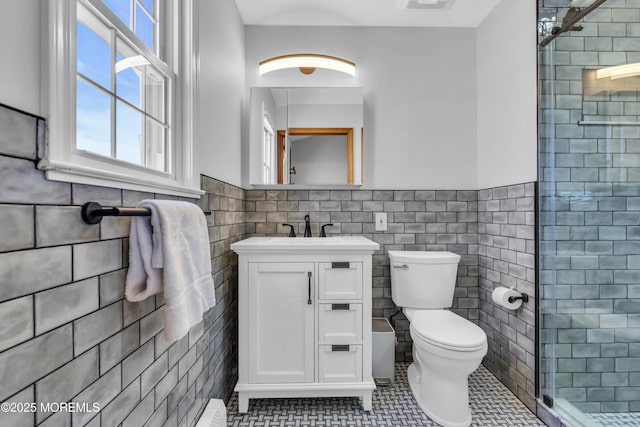 2400 Ocean Front, Lavallette, NJ 08735 - full bath with tile walls, vanity, a shower stall, tile patterned floors, and wainscoting