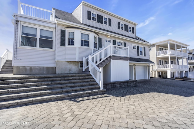2400 Ocean Front, Lavallette, NJ 08735 - view of front of house with a garage, decorative driveway, and stairs