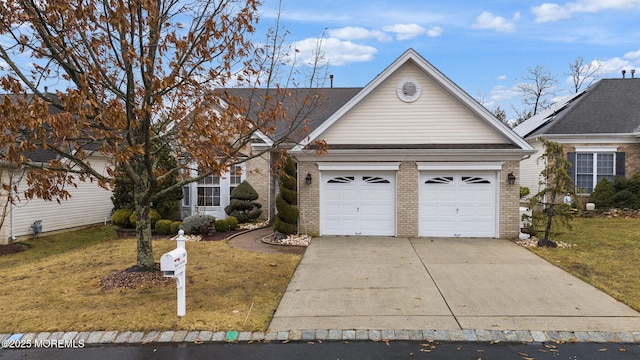 14 Barton Creek Rd, Jackson, NJ 08527 - traditional-style house with brick siding, a garage, a front yard, and concrete driveway