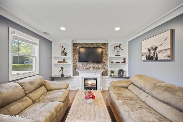 41 Alan Ter, Howell, NJ 07731 - living area featuring hardwood / wood-style flooring, crown molding, recessed lighting, a warm lit fireplace, and built in shelves