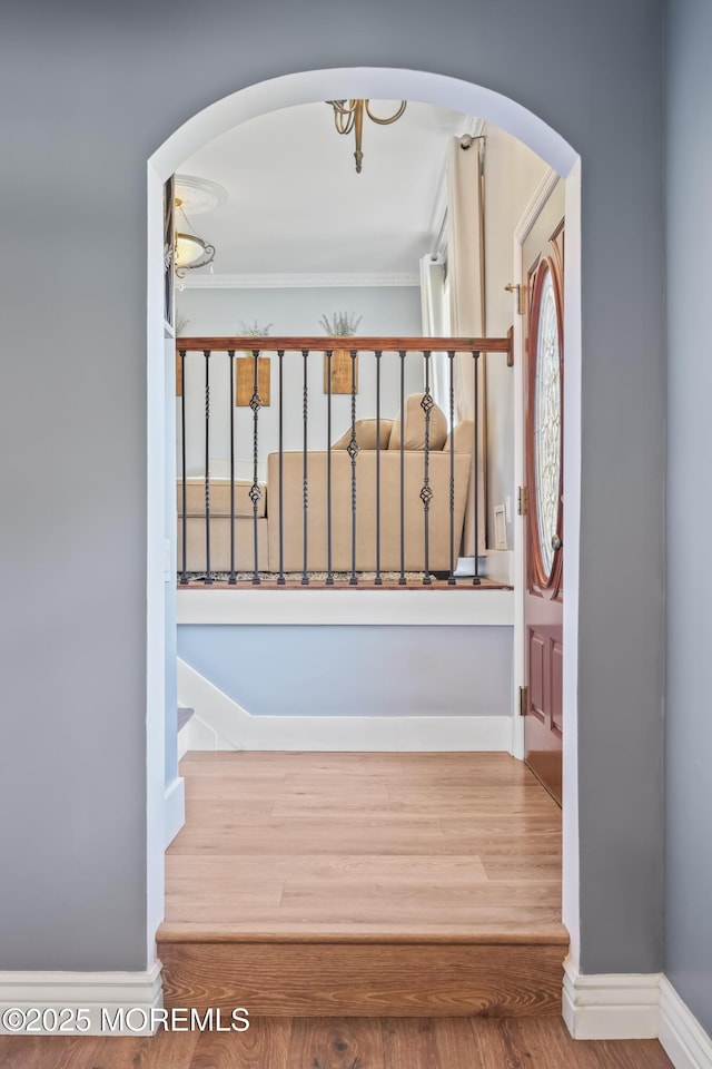 41 Alan Ter, Howell, NJ 07731 - stairway featuring arched walkways, wood finished floors, and crown molding