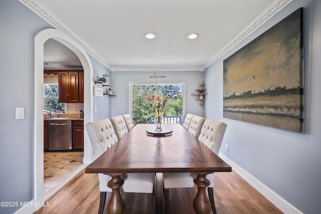 41 Alan Ter, Howell, NJ 07731 - dining area featuring arched walkways, light wood-style flooring, healthy amount of natural light, recessed lighting, and crown molding