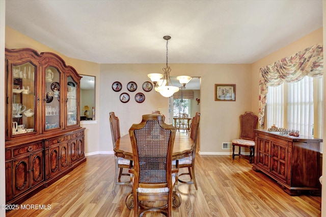 6 Thatcher Ct, Jackson, NJ 08527 - dining space with a chandelier and light wood-style flooring