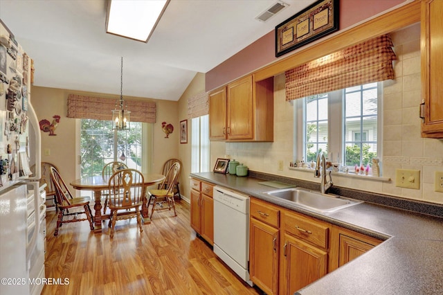 6 Thatcher Ct, Jackson, NJ 08527 - kitchen with dishwasher, healthy amount of natural light, light wood-style flooring, vaulted ceiling, and dark countertops