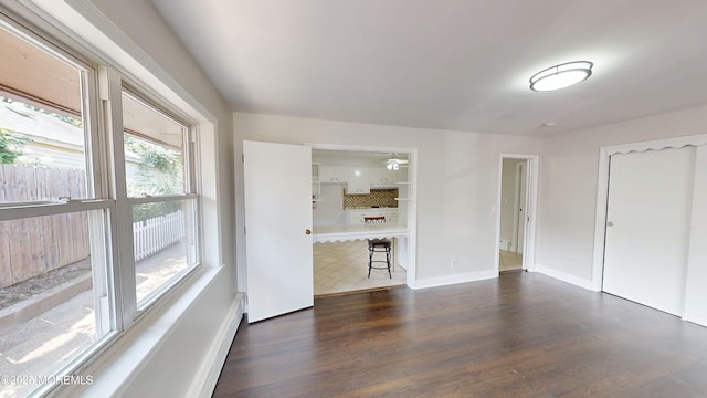 574 Main St, Sayreville, NJ 08872 - unfurnished living room featuring wood finished floors and baseboards