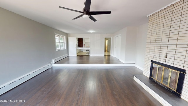 574 Main St, Sayreville, NJ 08872 - unfurnished living room featuring a fireplace, a baseboard heating unit, a ceiling fan, and wood finished floors