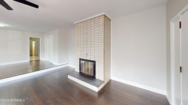 574 Main St, Sayreville, NJ 08872 - unfurnished living room featuring a ceiling fan, wood finished floors, and a tile fireplace