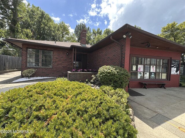 574 Main St, Sayreville, NJ 08872 - ranch-style house with brick siding and a chimney