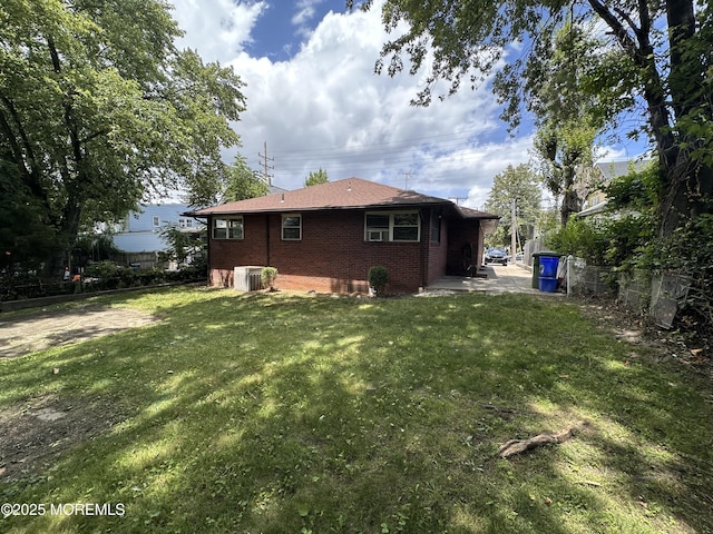574 Main St, Sayreville, NJ 08872 - back of property with a patio area and brick siding