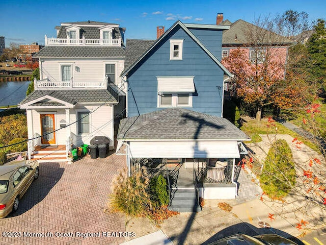 63 Asbury Ave, Ocean Grove, NJ 07756 - rear view of property featuring a porch