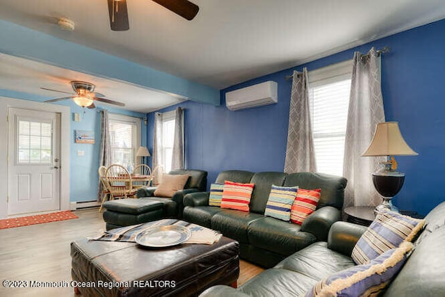 63 Asbury Ave, Ocean Grove, NJ 07756 - living room with ceiling fan, a wall unit AC, wood finished floors, and a baseboard radiator