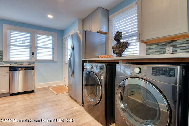 63 Asbury Ave, Ocean Grove, NJ 07756 - laundry area with separate washer and dryer, light wood finished floors, and recessed lighting