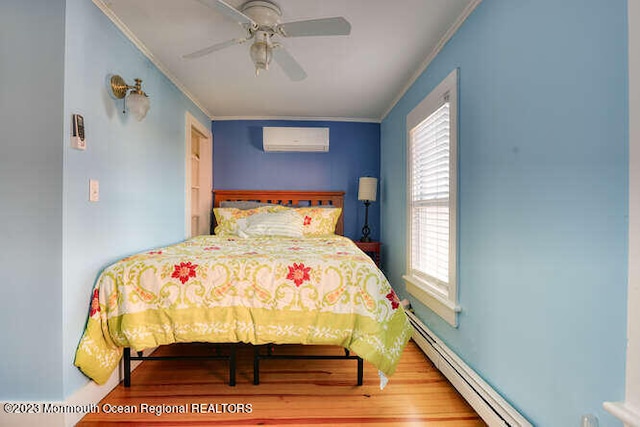 63 Asbury Ave, Ocean Grove, NJ 07756 - bedroom featuring crown molding, a wall unit AC, multiple windows, wood finished floors, and baseboard heating