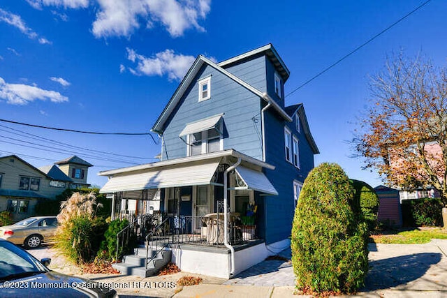 63 Asbury Ave, Ocean Grove, NJ 07756 - american foursquare style home featuring covered porch