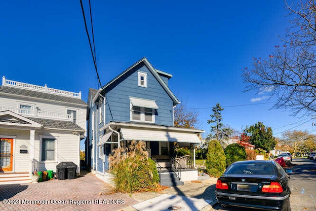 63 Asbury Ave, Ocean Grove, NJ 07756 - view of front of house featuring covered porch