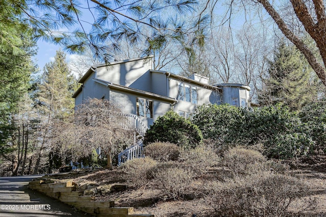 7 Jayhawk Way, Holmdel, NJ 07733 - view of side of property featuring stairway and a chimney
