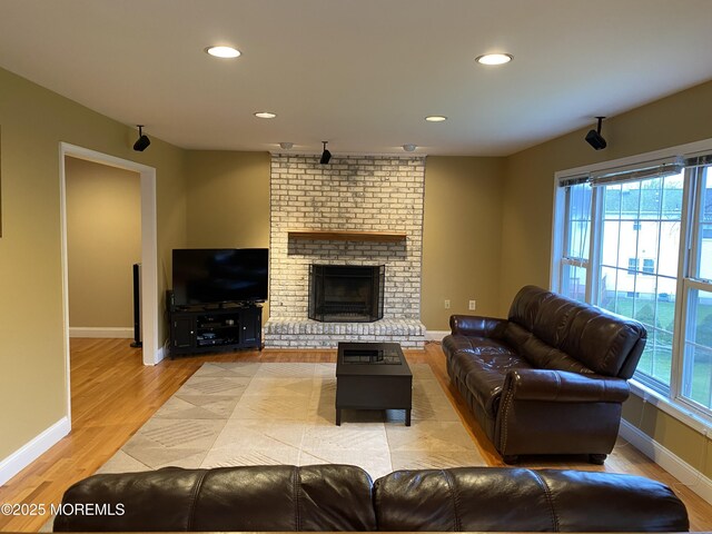 7 Erte Pl, Marlboro, NJ 07746 - living room with light wood-style floors, recessed lighting, and a brick fireplace