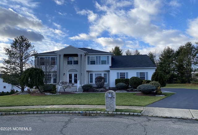 7 Erte Pl, Marlboro, NJ 07746 - neoclassical / greek revival house featuring a front yard and french doors