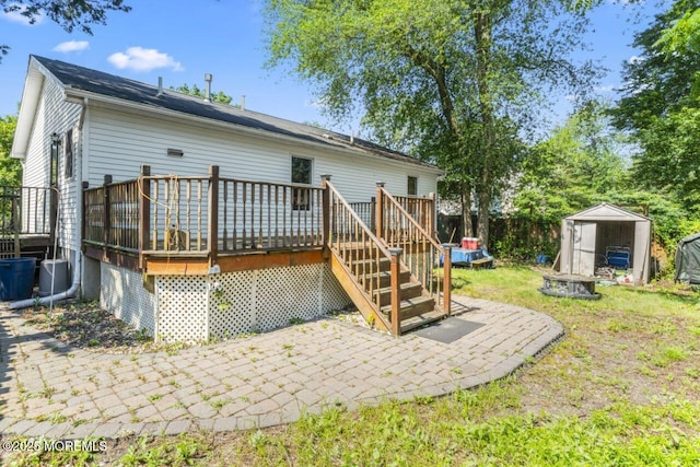 45 Letts Landing Rd, Waretown, NJ 08758 - rear view of property featuring a storage unit, a patio area, and a deck