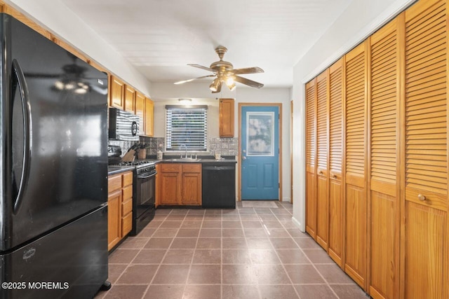 45 Letts Landing Rd, Waretown, NJ 08758 - kitchen with black appliances, decorative backsplash, ceiling fan, dark countertops, and dark tile patterned flooring