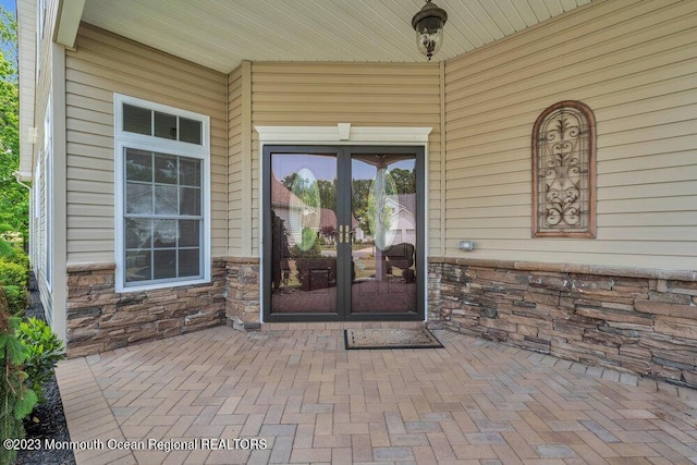 25 Merion Ln, Jackson, NJ 08527 - entrance to property with french doors and stone siding