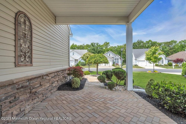 25 Merion Ln, Jackson, NJ 08527 - covered porch with a residential view and a yard