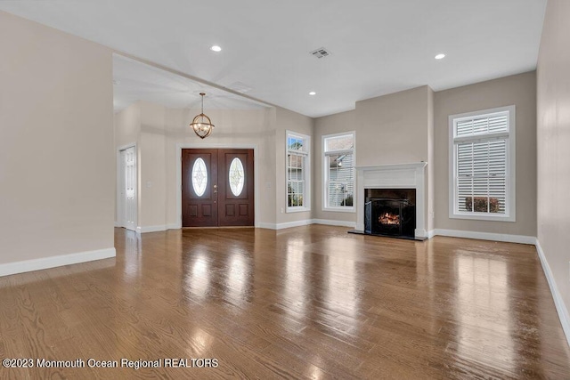 25 Merion Ln, Jackson, NJ 08527 - entrance foyer with a chandelier, wood finished floors, a high end fireplace, and recessed lighting