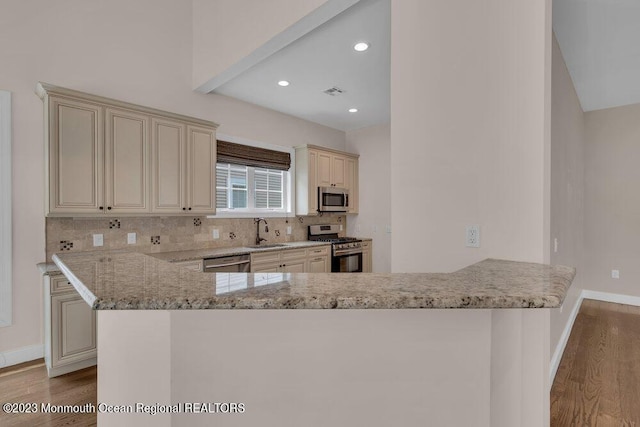 25 Merion Ln, Jackson, NJ 08527 - kitchen with cream cabinets, stainless steel appliances, wood finished floors, backsplash, and recessed lighting