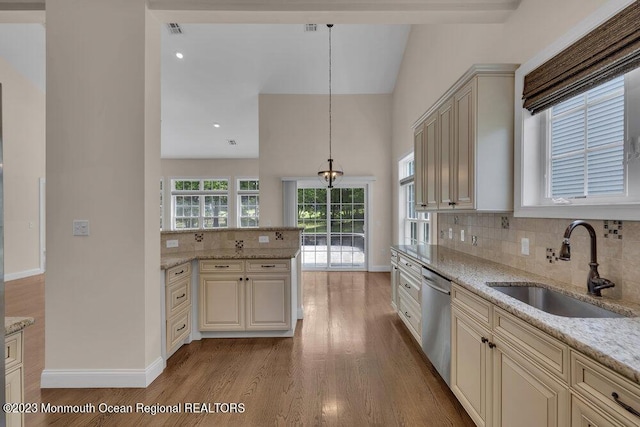 25 Merion Ln, Jackson, NJ 08527 - kitchen featuring dishwasher, light wood-style floors, tasteful backsplash, cream cabinetry, and light stone counters